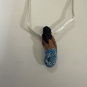 Black-haired dark skin Mermaid Clay Pendant on white cord